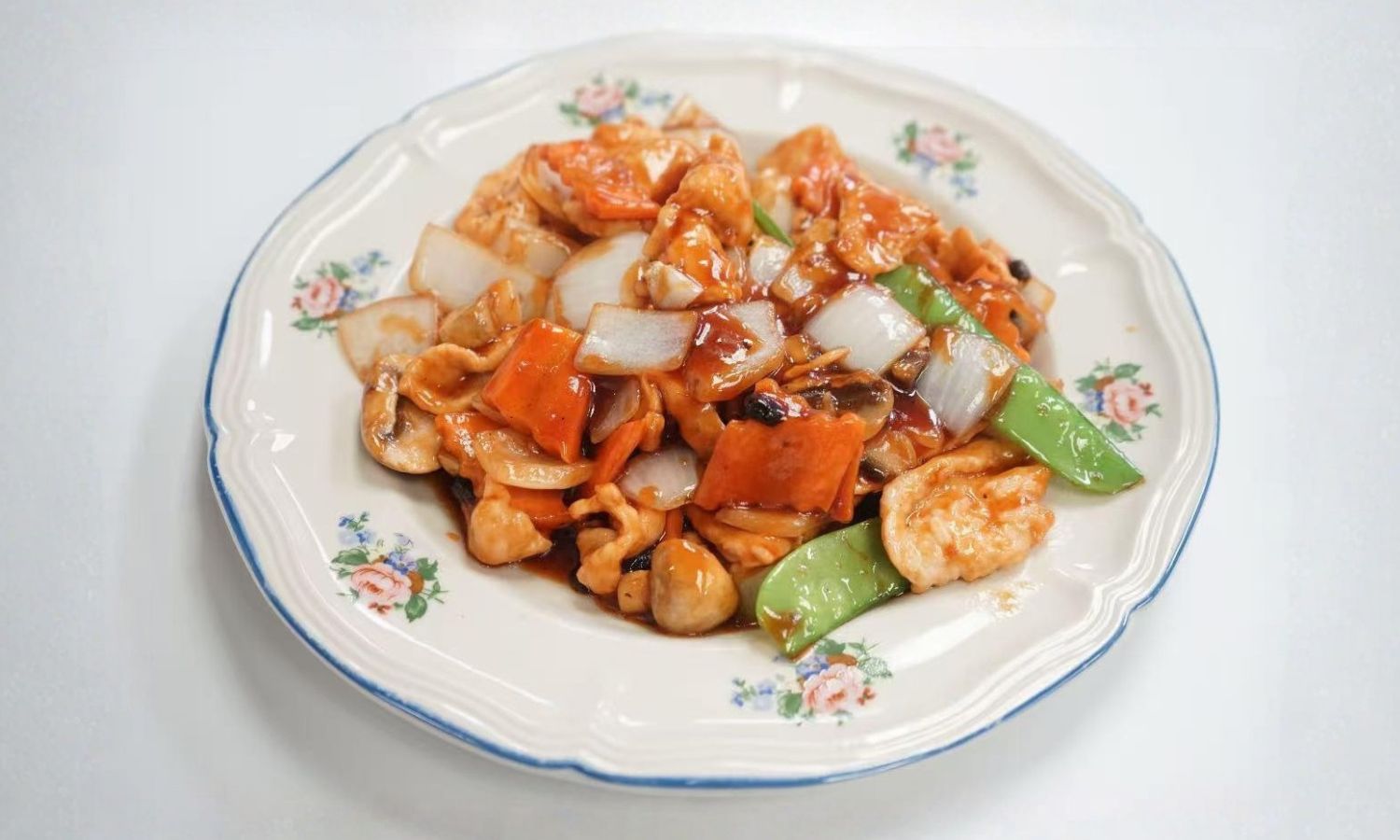 Spicy stir-fried chicken with shrimp, onions and peppers at Peking Gourmet, a Chinese Restaurant in Frederick